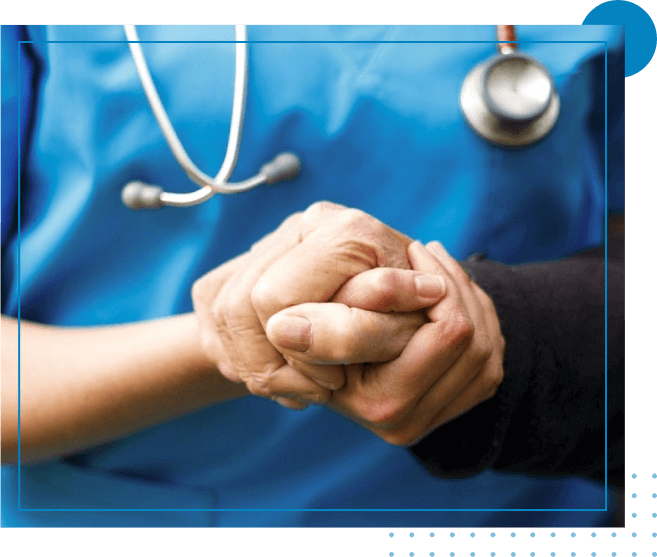 A person holding hands with another person in front of a stethoscope.